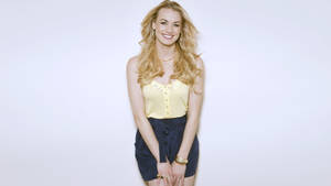 Yvonne Strahovski In Yellow Blouse And Black Skirt Wallpaper