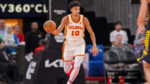 Zaccharie Risacher Playing Basketball Wallpaper