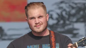 Zach Bryan Performingat Event Wallpaper