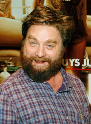 Zach Galifianakis Looking Contemplative In A Denim Jacket. Wallpaper