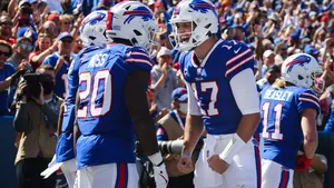 Zack Moss Celebrationwith Teammate Wallpaper