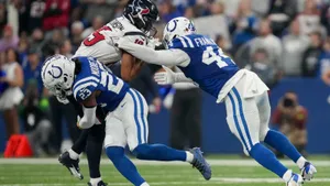 Zaire Franklin Tackling Opponent During Game Wallpaper