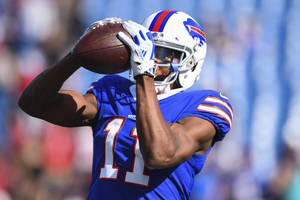 Zay Jones Holding Ball To Face Wallpaper