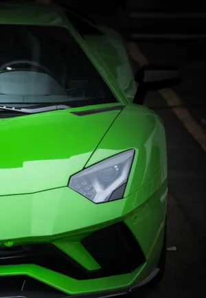 Zoom Into Luxury: An Up Close Look Of A Green Lamborghini. Wallpaper